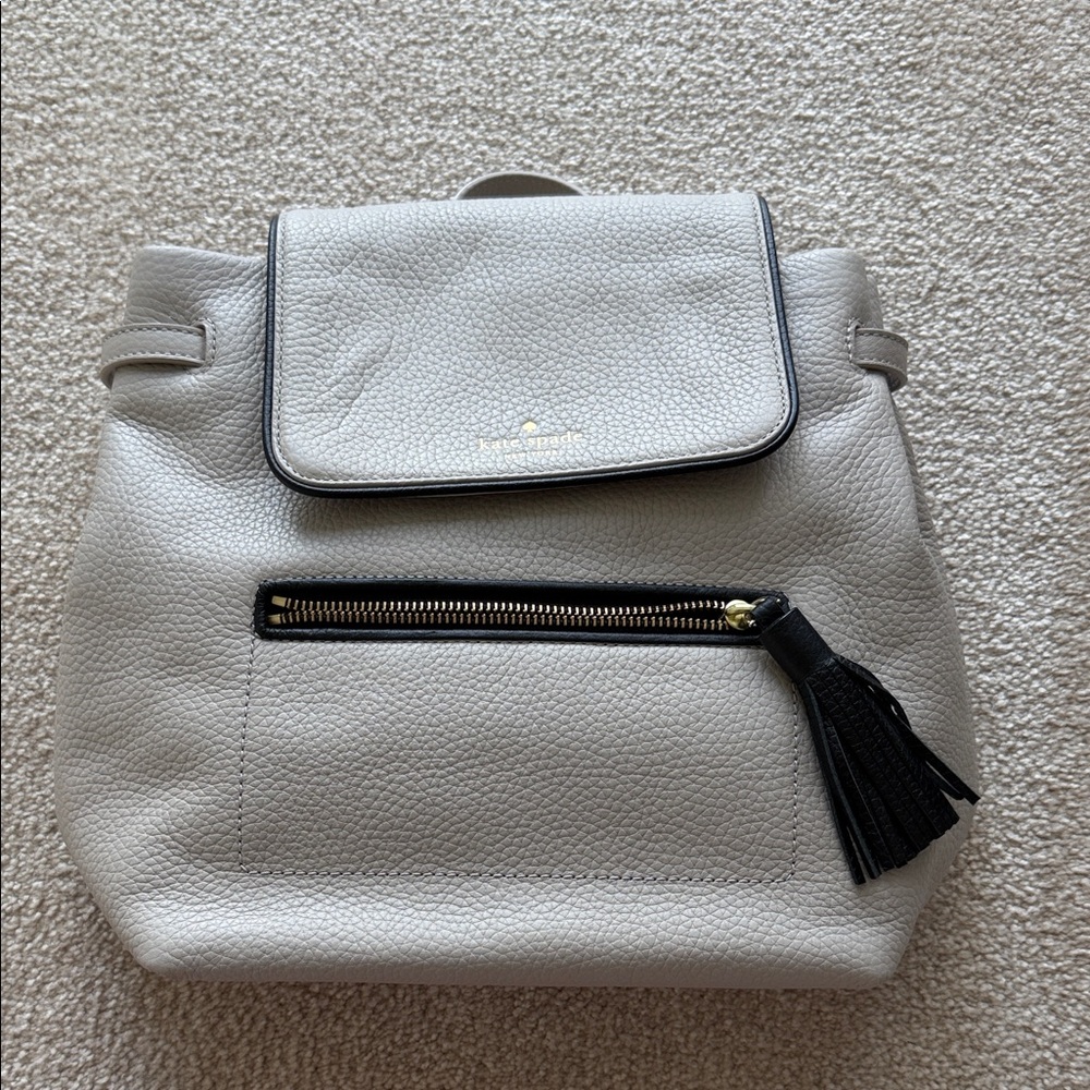 kate spade Light Gray Pebbled Leather Backpack with Black Tassel
